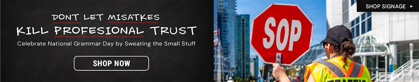 Traffic control worker wearing a safety vest holding a red stop sign paddle at a busy intersection. Text reads “Shop Signage” and “Shop Now.”