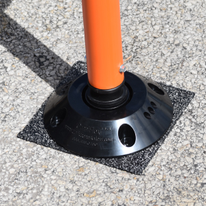 Omniflex delineator and exclusive base secured to road with Thermo Pad for permanent high-traffic safety installation.