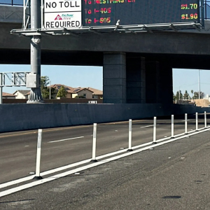 Omniflex delineators separating toll lanes from highway traffic for high-visibility lane control and flexible traffic safety.
