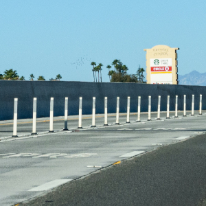 Omniflex delineators dividing toll lanes from highway lanes for durable, high-visibility traffic separation and safety.
